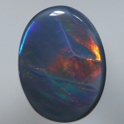 SOLID BLACK OPAL Large rolling flashes of copper orange